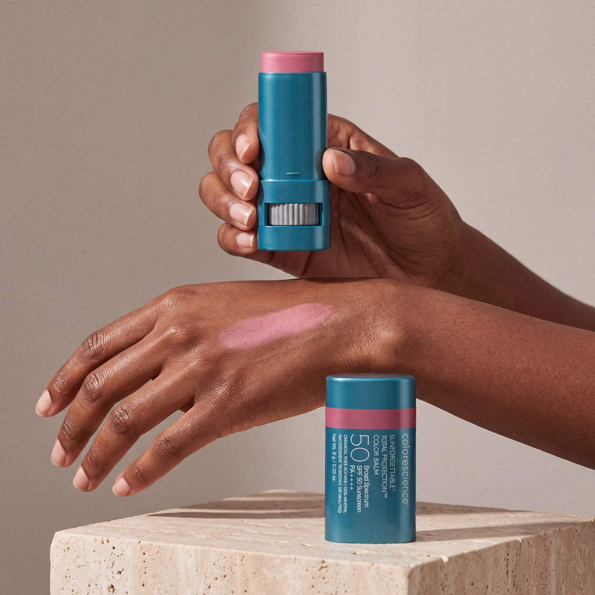 Colorescience Colour Balm Violet Haze in hand with swatch