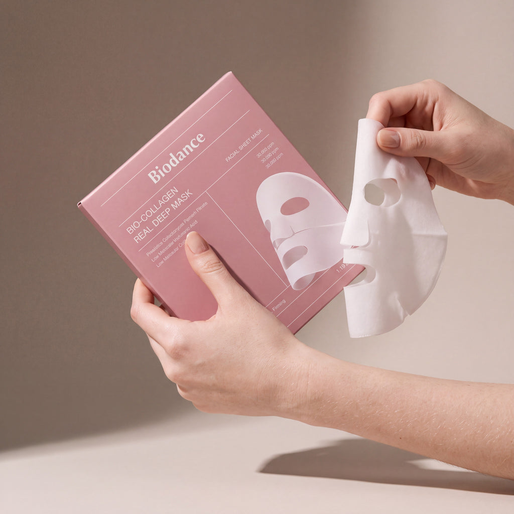 Biodance Bio-Collagen Real Deep Mask 4pcs held in hands, editorial studio shot