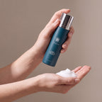 VI DERM Gentle Purifying Cleanser held in hands, editorial studio shot