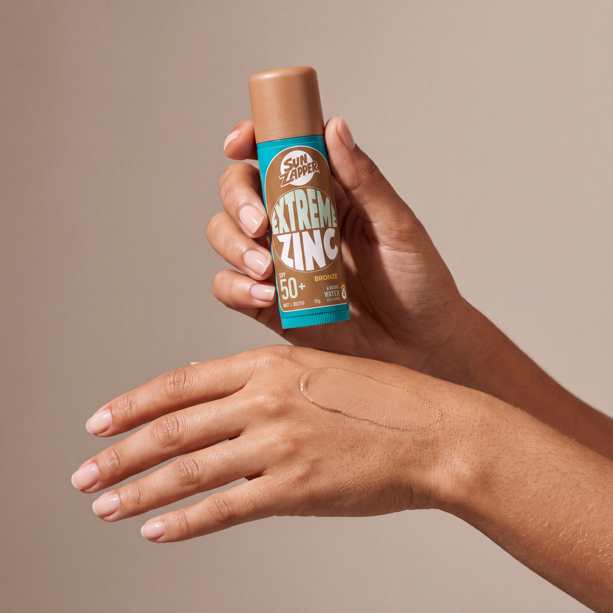 Sun ZAPPER Extreme zinc bronze held in hands, editorial studio shot