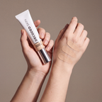 Decoded Treatment Foundation no 1 held in hands, editorial studio shot