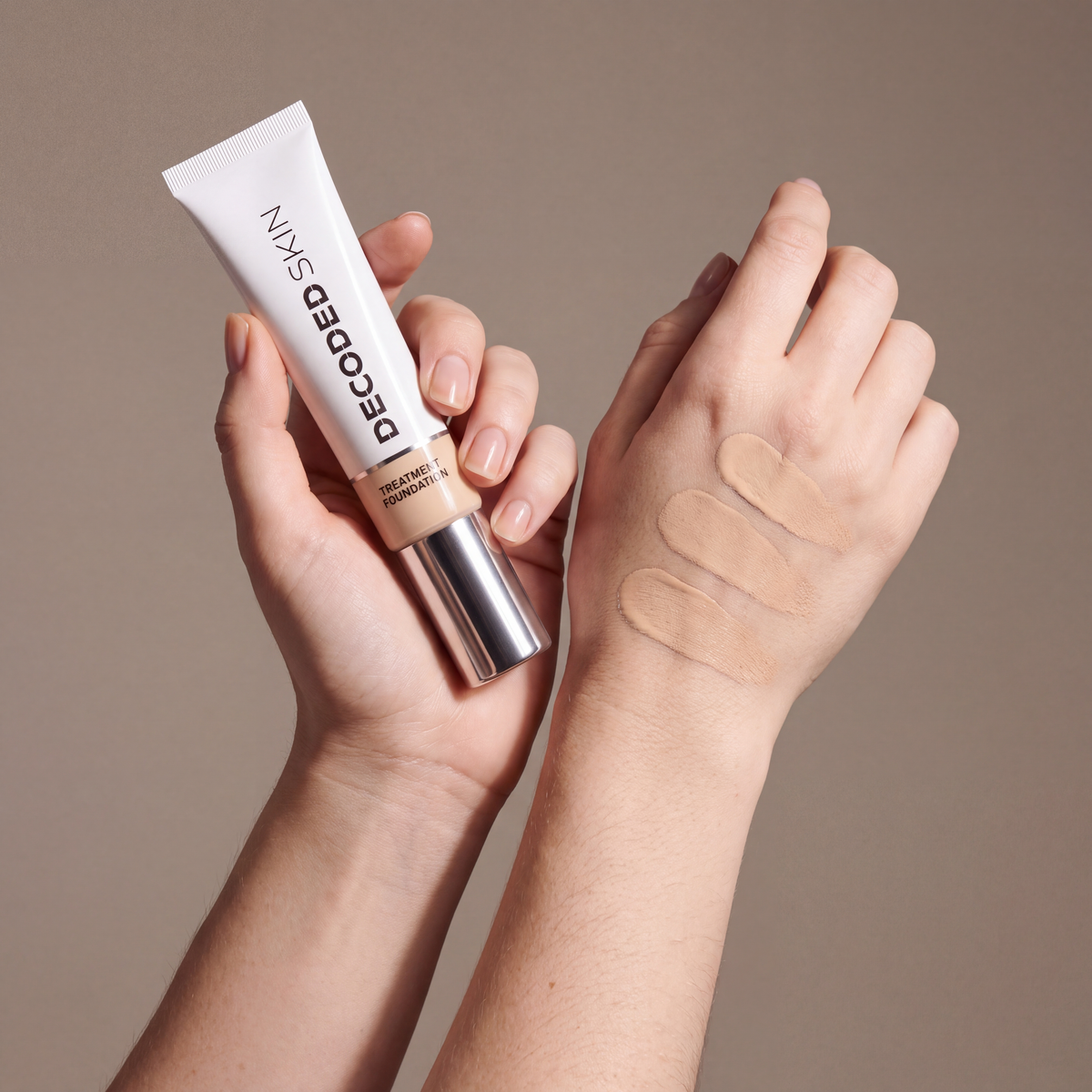 Decoded Treatment Foundation no 1 held in hands, editorial studio shot