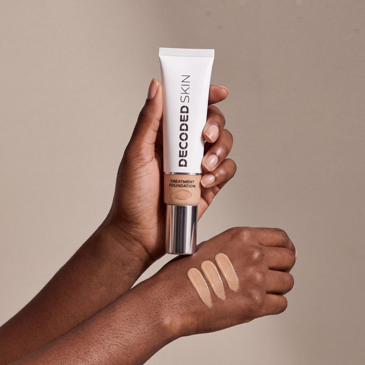 Decoded Treatment Foundation no 5 held in hands, editorial studio shot