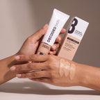 Decoded Treatment Foundation no 3 held in hands, editorial studio shot