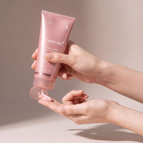Medicube Collagen Night Wrapping Mask held in hands, editorial studio shot