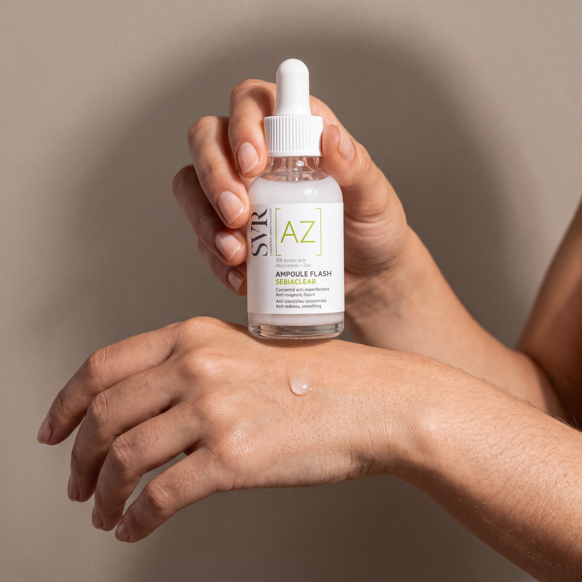 SVR Sebiaclear Ampoule Flash AZ held in hands, editorial studio shot