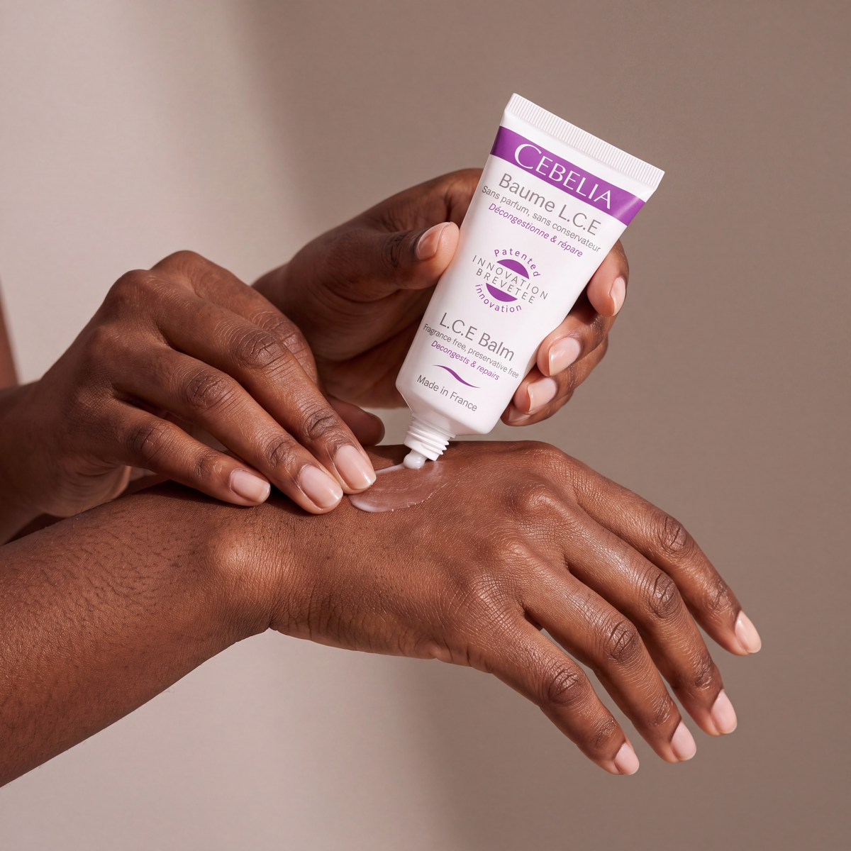 Cebelia LCE Balm held in hands, editorial studio shot