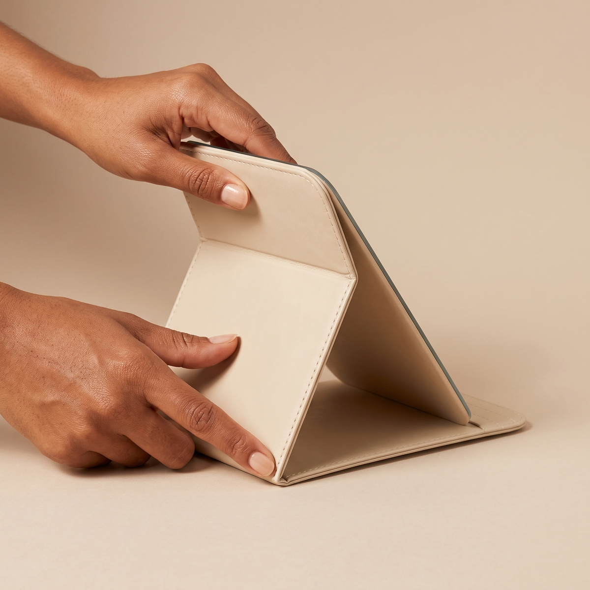 Portable PU Leather Foldable Makeup Mirror held in hands, editorial studio shot